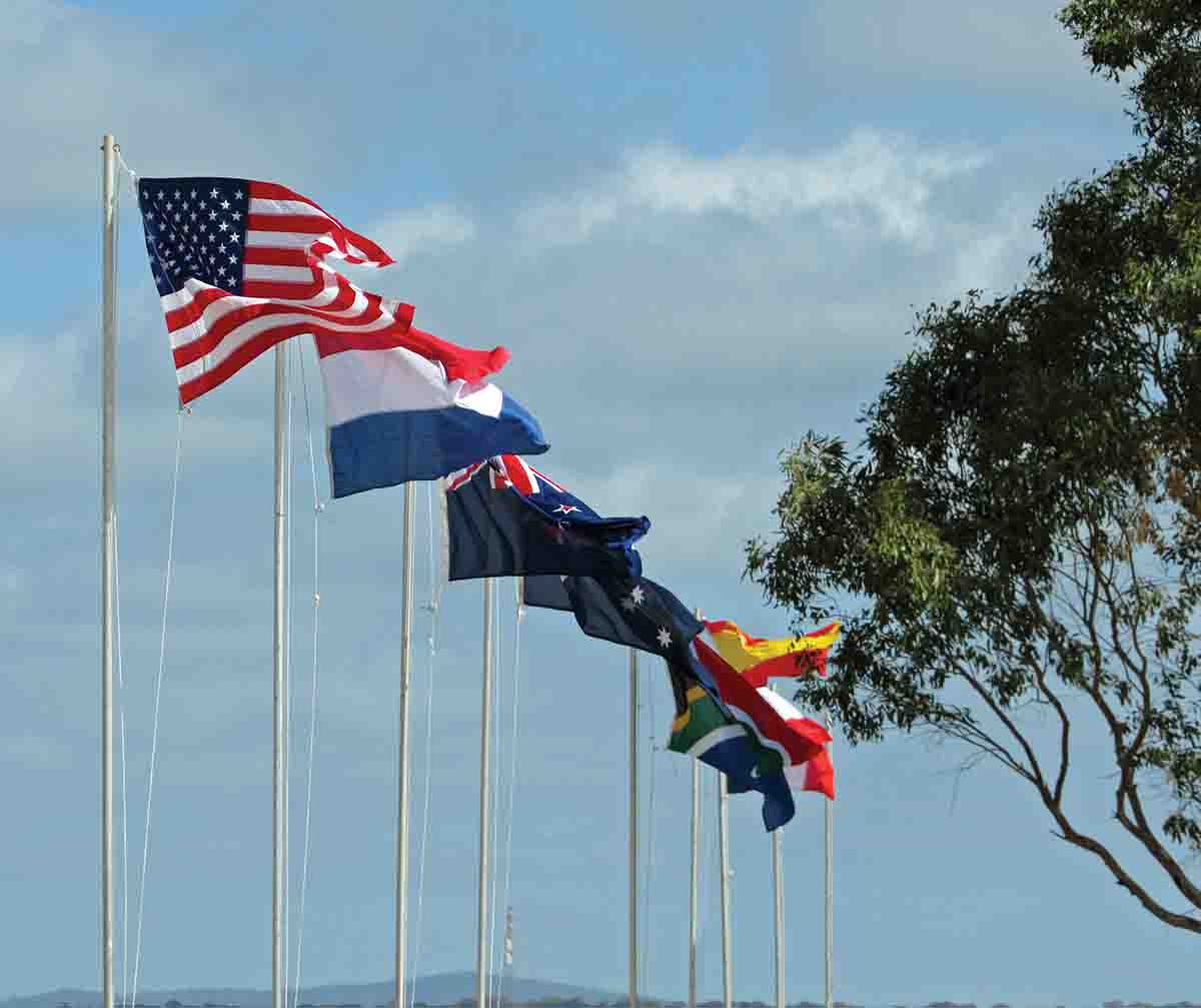 Flags of the participating countries: United States, France, Australia, New Zealand, South Africa, Spain and Netherlands.